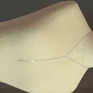 Lariat silver necklace the diamond chips in V and end of lariat. 14” long